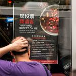 The 99 Favor Taste voter promotion poster also notes that customers who register to vote will get a 20% discount<br>(Scott Heins / Gothamist)